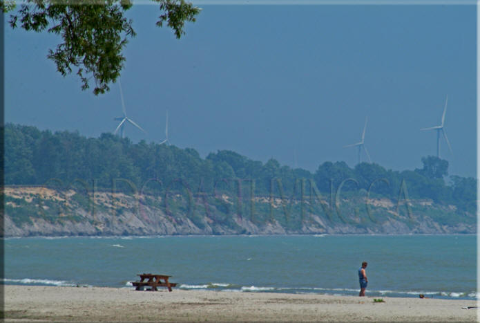 Photograph ofPhotograph of wind generators above  Port Burwell Beach, near the Port Burwell Pier on Lake Erie, Ontario