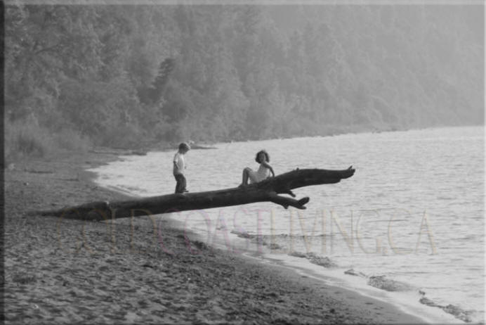 Photograph of children on log at Turkey Point Beach, Norfolk County on Lake Erie, Ontario