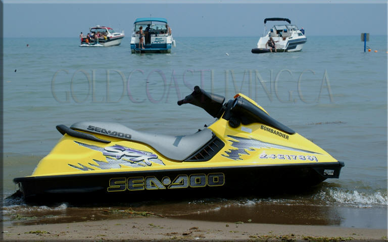 Photograph of seadoo and boats at Turkey Point Beach, Norfolk County on Lake Erie, Ontario
